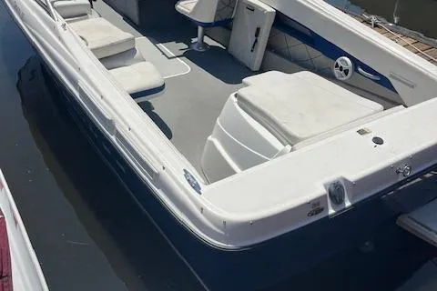 The Image of 2008 Bayliner 215 Discovery boat interior with seating and storage compartments. - 1