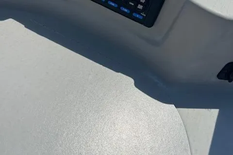 Slide: The Image of 2008 Bayliner 215 Discovery boat interior with control panel detail. - 7