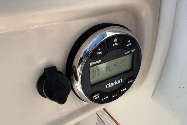 Slide: The Image of Clarion audio system on 2019 Robalo R207 Dual Console boat, displaying Bluetooth music. - 14