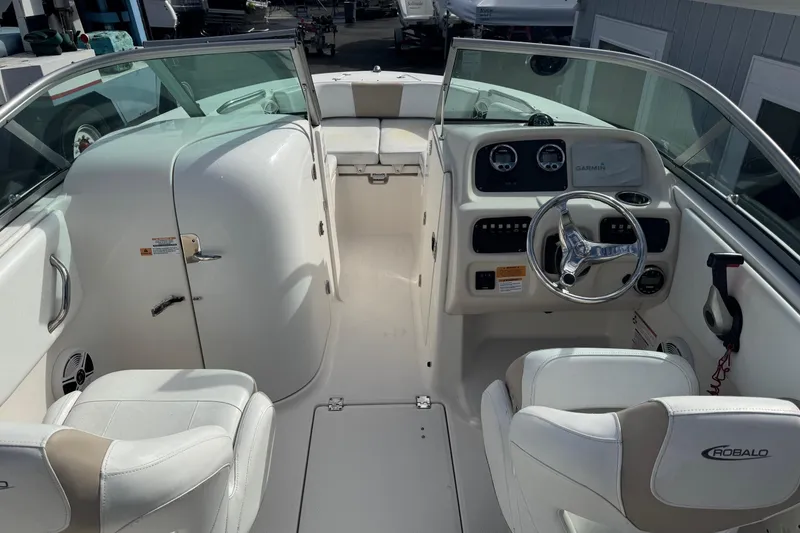Slide: The Image of 2019 Robalo R207 Dual Console boat interior with steering wheel and seating. - 31