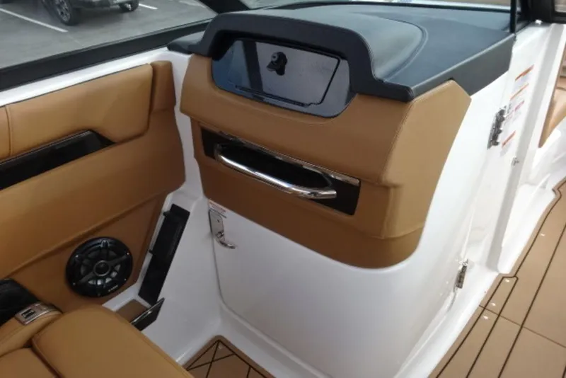Slide: The Image of Interior of 2026 Chaparral 6 GTS boat with tan and black accents. - 13