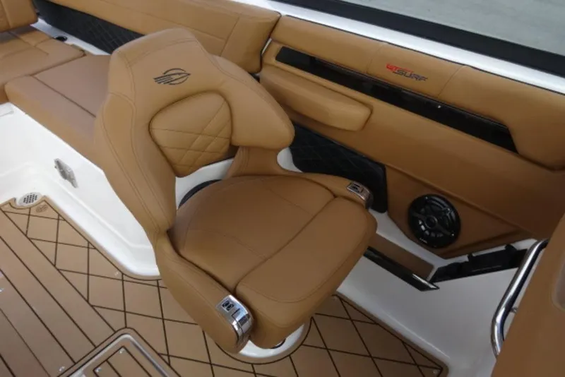 Slide: The Image of Luxurious tan interior of 2026 Chaparral 6 GTS boat with premium seating. - 14
