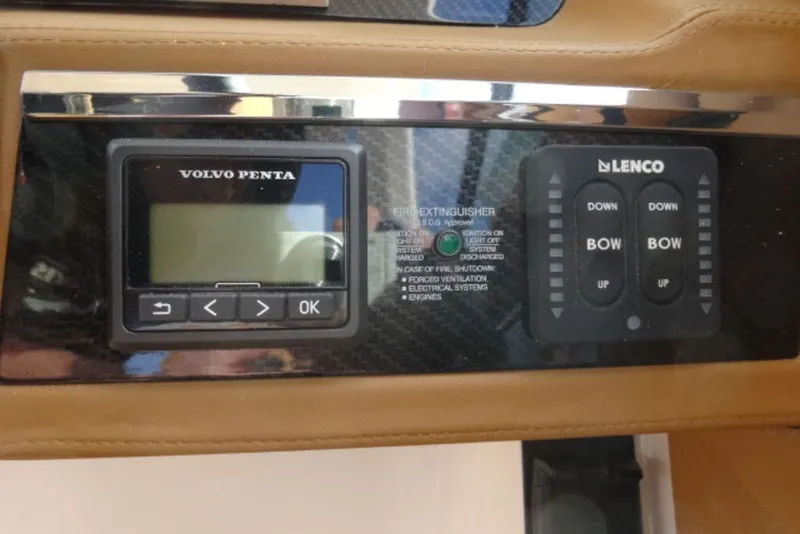 Slide: The Image of Control panel of 2026 Chaparral 6 GTS featuring Volvo Penta and Lenco systems. - 18