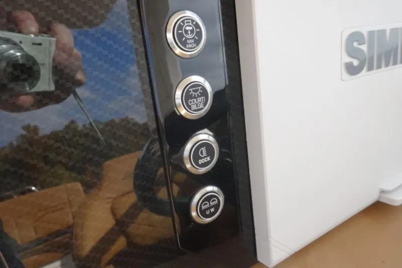 Slide: The Image of Control panel of 2026 Chaparral 6 GTS boat with various function buttons. - 20