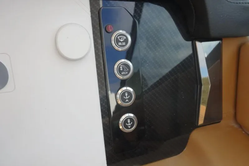 Slide: The Image of Control panel of 2026 Chaparral 6 GTS boat with various function buttons. - 22