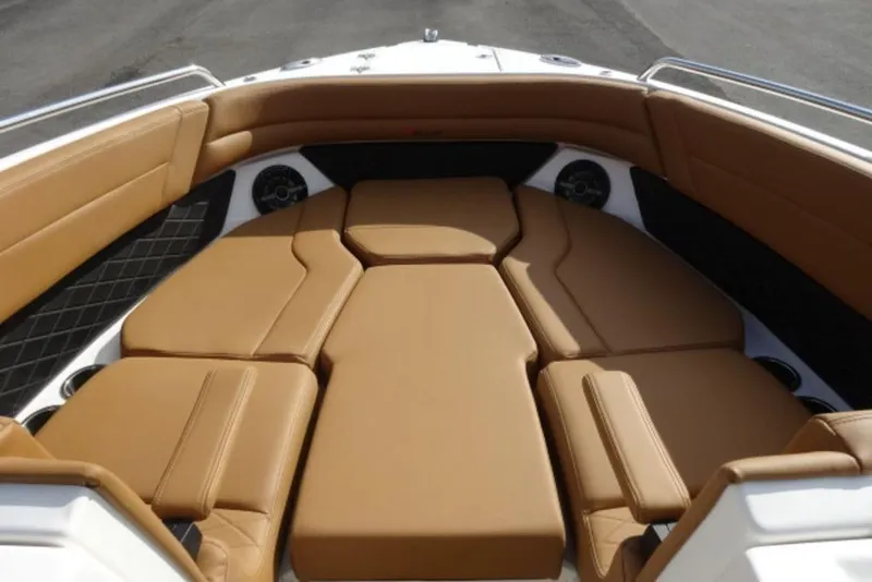 Slide: The Image of 2026 Chaparral 6 GTS boat interior with tan leather seating and sleek design. - 23