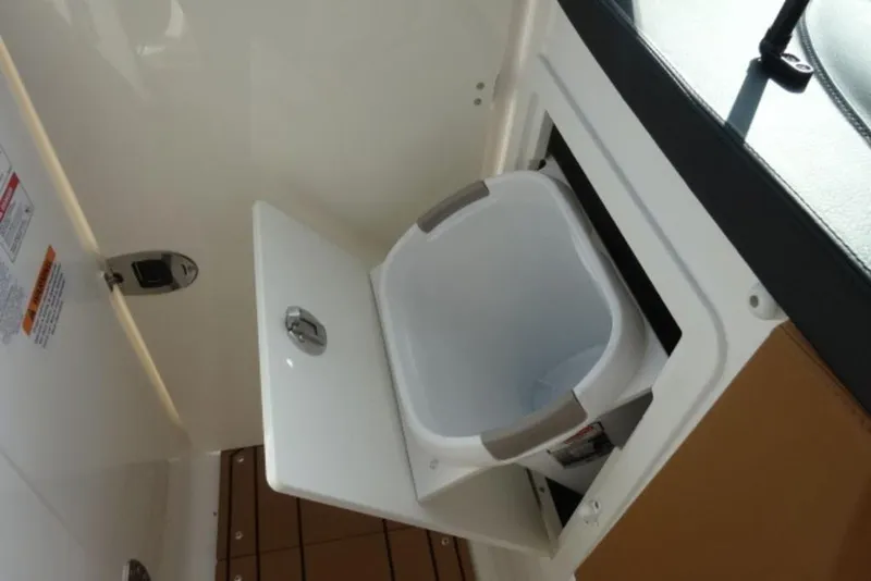 Slide: The Image of Built-in storage compartment on 2026 Chaparral 6 GTS boat. - 25