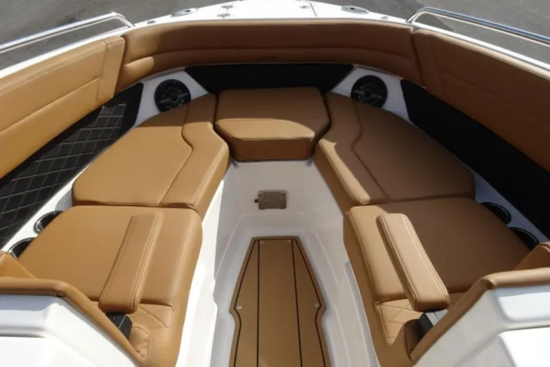 Slide: The Image of Luxurious interior of 2026 Chaparral 6 GTS boat with tan leather seating. - 26