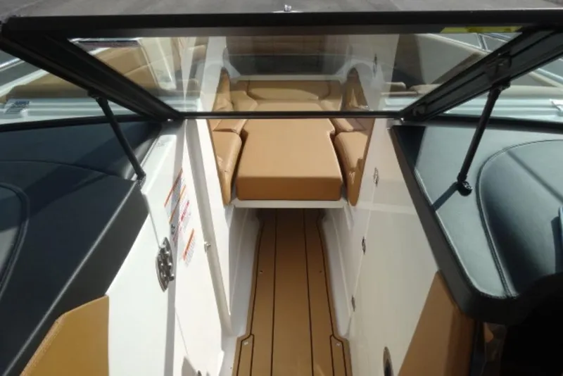 Slide: The Image of 2026 Chaparral 6 GTS boat interior with tan seating and sleek design. - 27