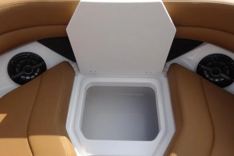 Slide: The Image of 2026 Chaparral 6 GTS boat interior with storage compartment and speakers. - 29