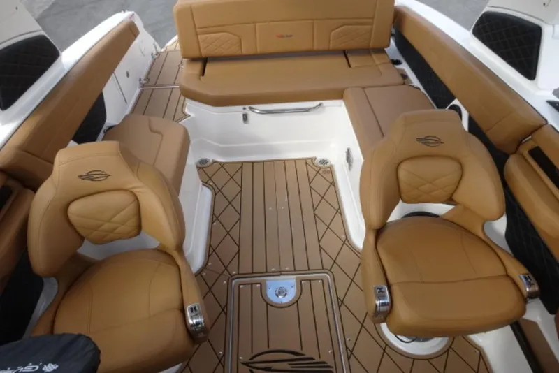 Slide: The Image of Luxurious interior of 2026 Chaparral 6 GTS boat with tan leather seating. - 31