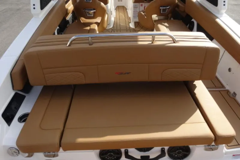 Slide: The Image of 2026 Chaparral 6 GTS boat interior with tan leather seating and modern design. - 7