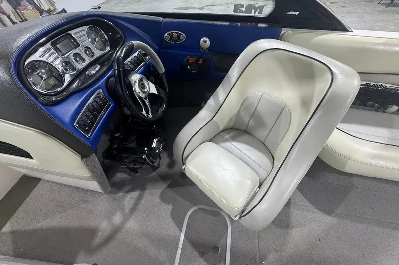 Slide: The Image of 2007 Malibu Wakesetter 23 LSV interior with steering wheel and dashboard controls. - 12