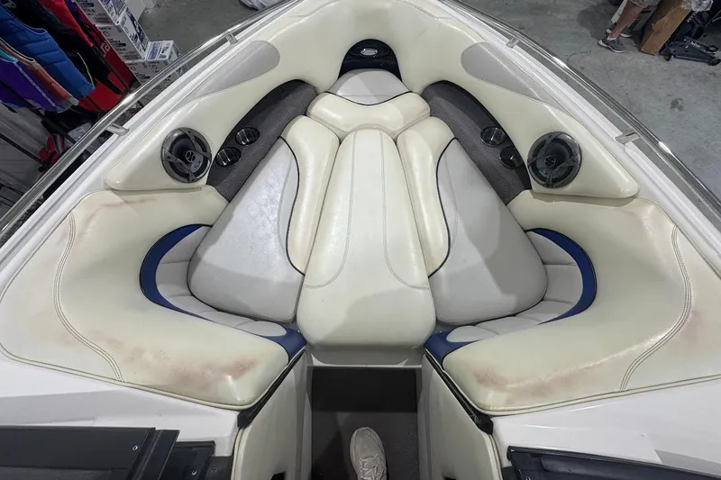 Slide: The Image of Interior of a 2007 Malibu Wakesetter 23 LSV boat with white and blue seating. - 13