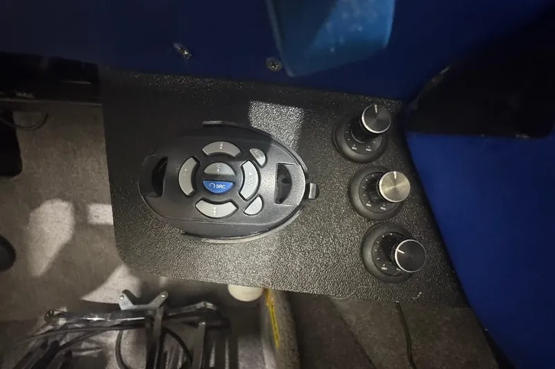 Slide: The Image of Control panel of a 2007 Malibu Wakesetter 23 LSV boat with audio and adjustment knobs. - 18