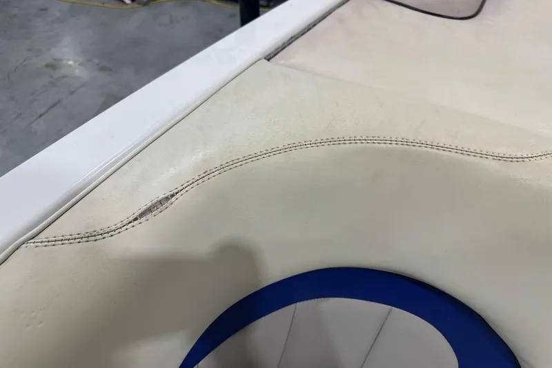 Slide: The Image of 2007 Malibu Wakesetter 23 LSV boat seat with visible stitching and minor wear. - 24