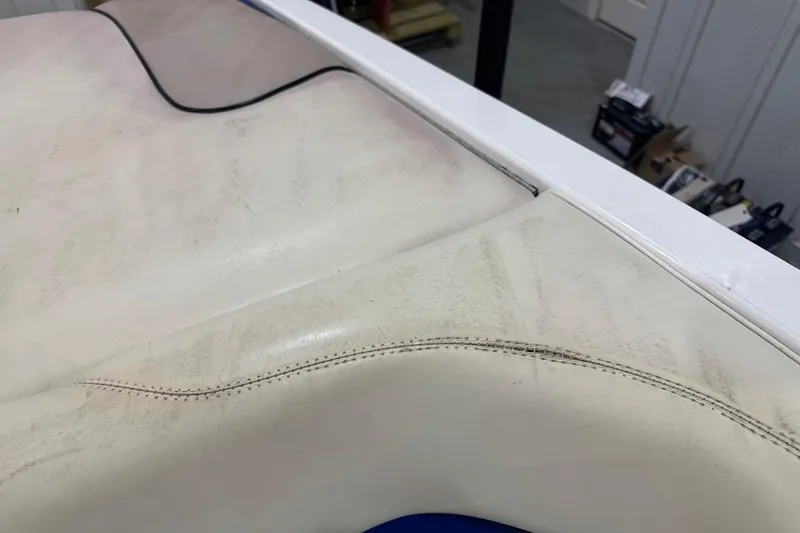 Slide: The Image of Close-up of 2007 Malibu Wakesetter 23 LSV boat seat with visible wear and stitching. - 25