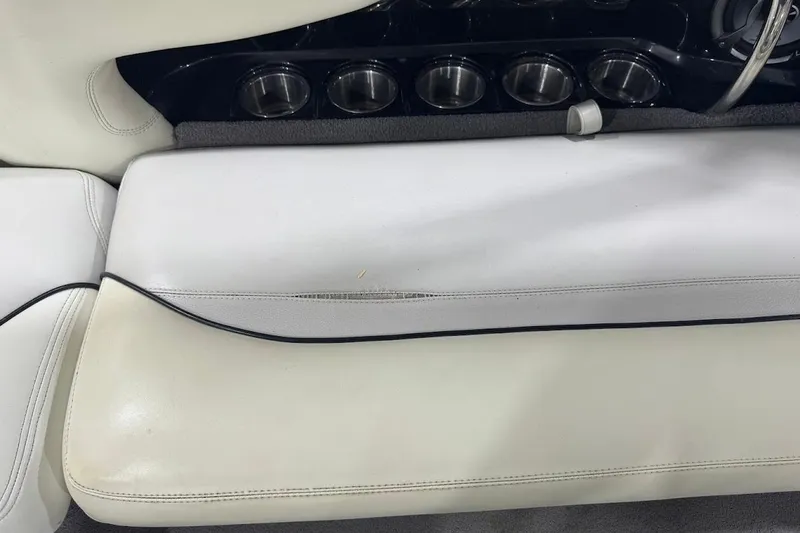 Slide: The Image of 2007 Malibu Wakesetter 23 LSV interior with white seating and cup holders. - 26