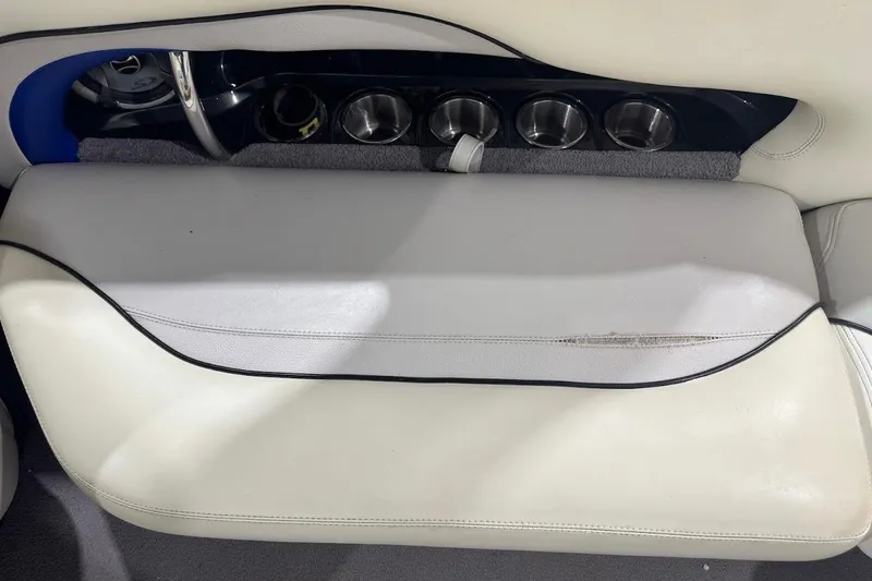 Slide: The Image of 2007 Malibu Wakesetter 23 LSV interior with white seating and cup holders. - 27