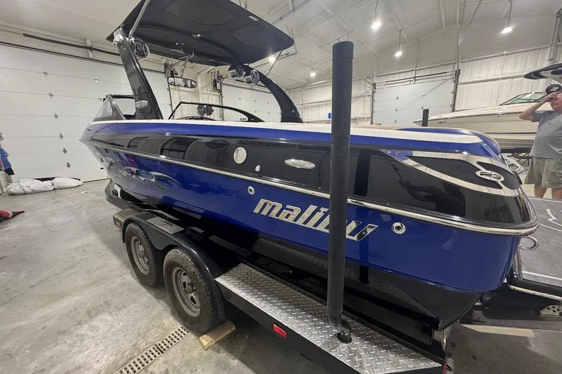 Slide: The Image of 2007 Malibu Wakesetter 23 LSV boat in a garage on a trailer. - 3