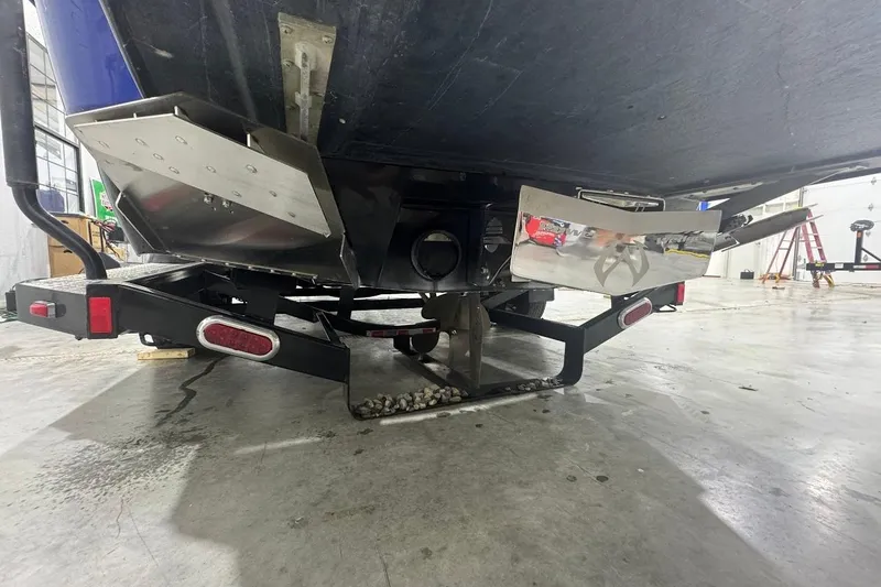 Slide: The Image of 2007 Malibu Wakesetter 23 LSV boat on trailer, showing underside and propeller. - 4