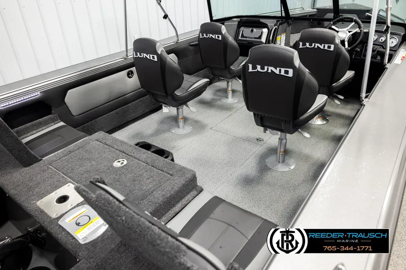 Slide: The Image of 2026 Lund 1975 Tyee boat interior with four seats and modern dashboard. - 11