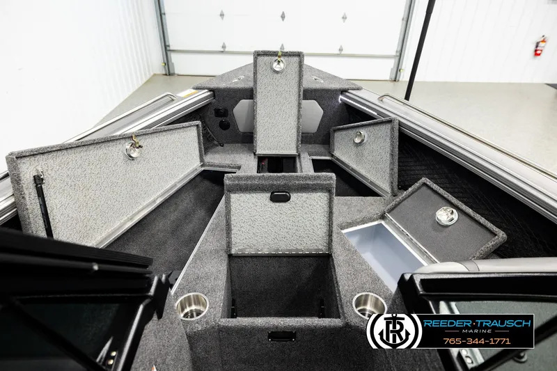 Slide: The Image of 2026 Lund 1975 Tyee boat interior with open storage compartments and cup holders. - 15