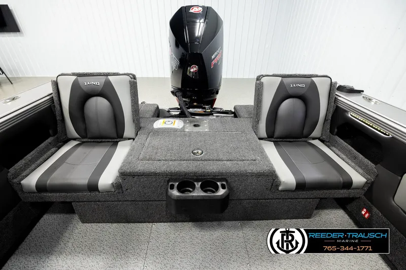 Slide: The Image of Interior of 2026 Lund 1975 Tyee boat with seating and motor, Reeder-Trausch Marine logo. - 18