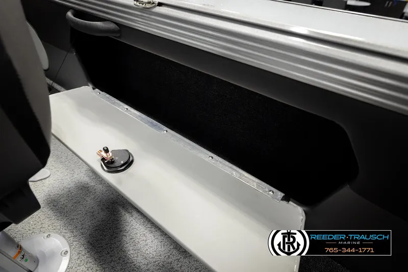 Slide: The Image of Interior of 2026 Lund 1975 Tyee boat, featuring seating and storage area. - 25