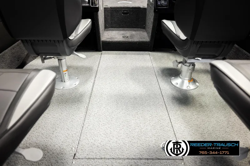 Slide: The Image of Interior of 2026 Lund 1975 Tyee boat with two swivel seats and carpeted flooring. - 28