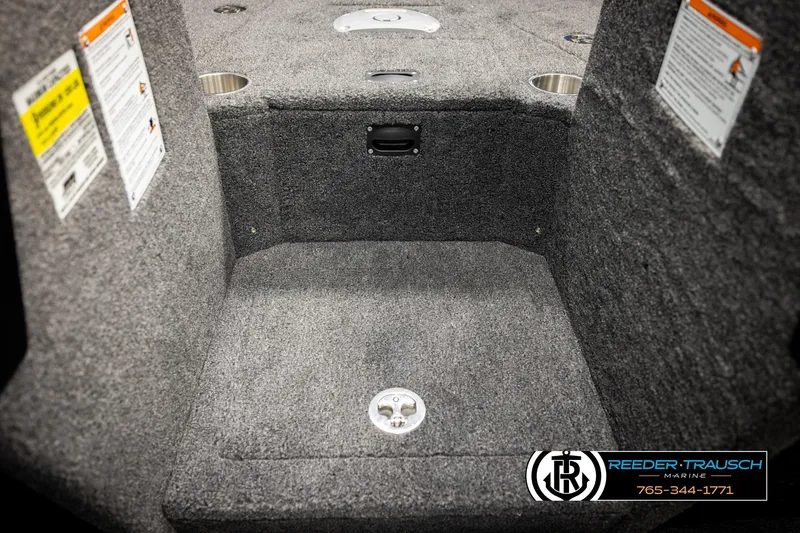 Slide: The Image of Interior of 2026 Lund 1975 Tyee boat with carpeted flooring and storage compartments. - 30