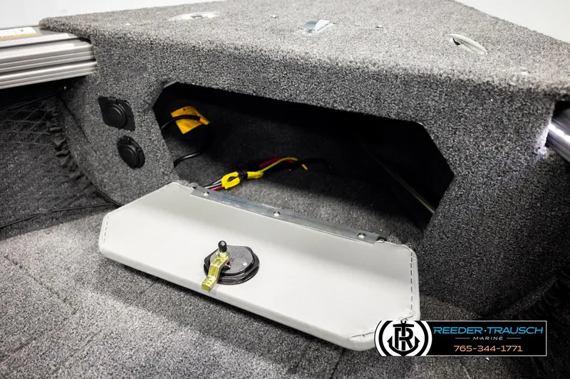 Slide: The Image of Interior of 2026 Lund 1975 Tyee boat with storage compartment and wiring. - 33