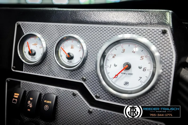 Slide: The Image of Dashboard of 2026 Lund 1975 Tyee boat with trim, fuel, and RPM gauges. - 40