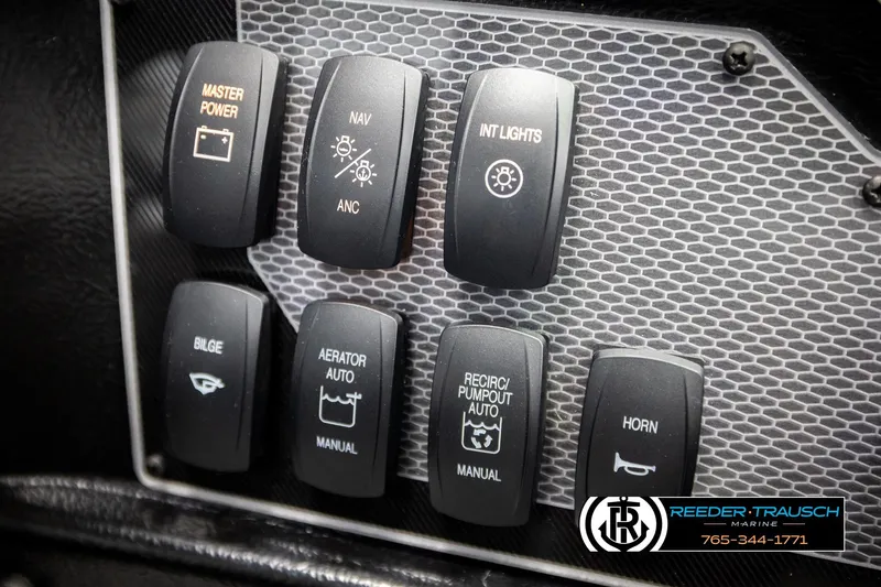 Slide: The Image of Control panel of 2026 Lund 1975 Tyee boat with various switches. - 41