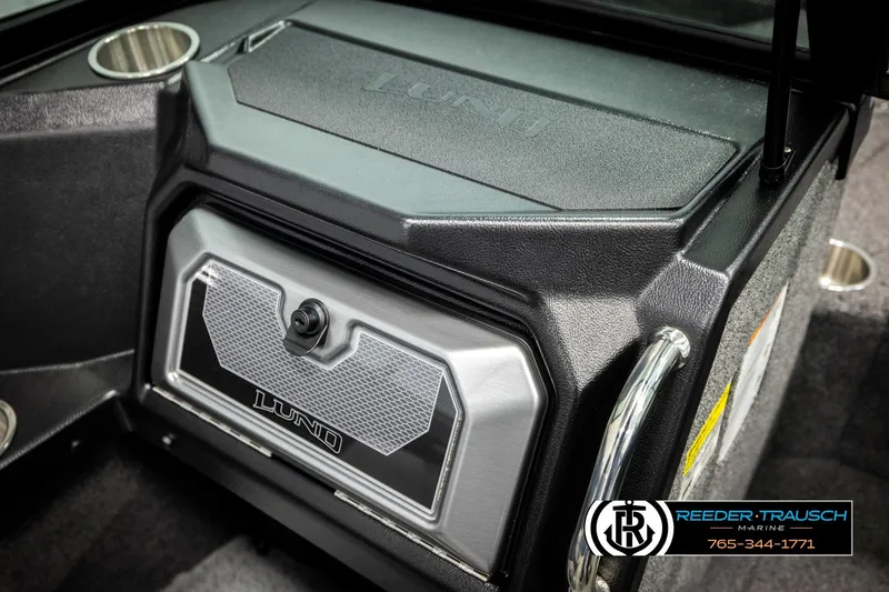 Slide: The Image of 2026 Lund 1975 Tyee boat dashboard with storage compartment and cup holder. - 44