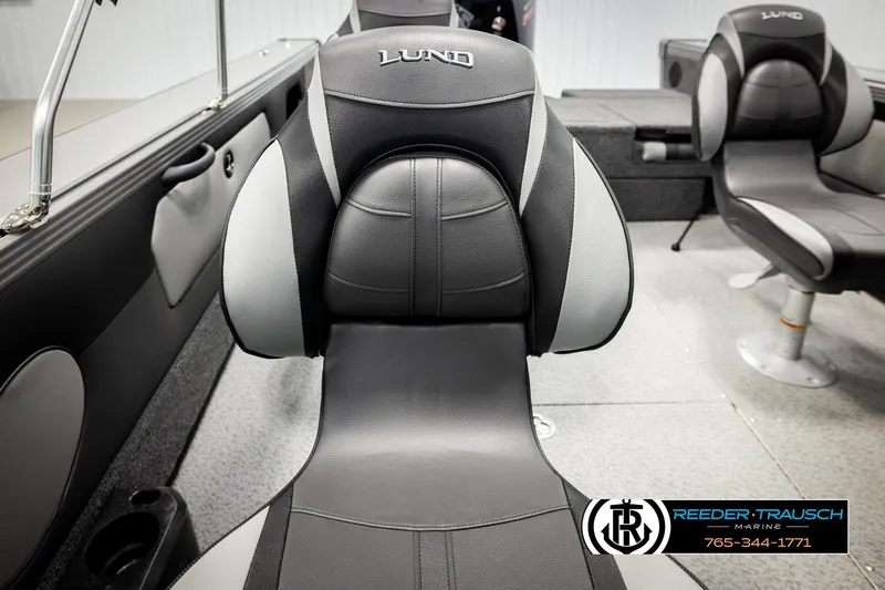 Slide: The Image of 2026 Lund 1975 Tyee boat interior with gray and black seating. - 45