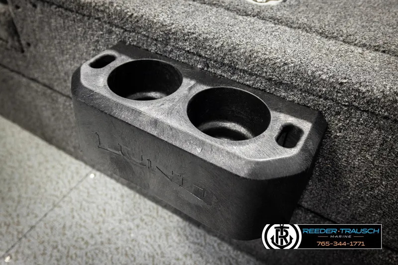 Slide: The Image of Cup holder in a 2026 Lund 1975 Tyee boat, featuring Reeder-Trausch Marine branding. - 48