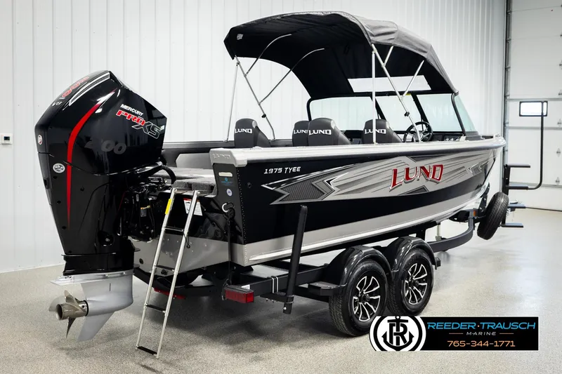Slide: The Image of 2026 Lund 1975 Tyee boat with Mercury Pro XS engine in showroom. - 5
