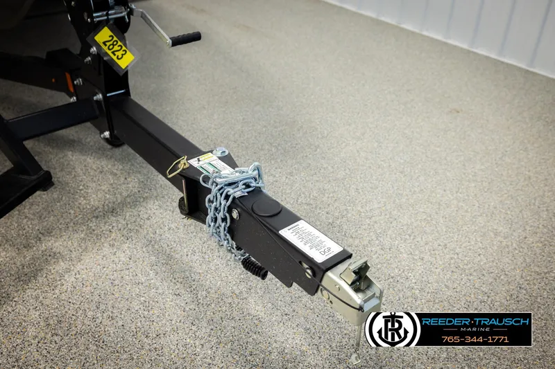 Slide: The Image of Trailer hitch of a 2026 Lund 1975 Tyee boat, secured with a chain. - 55