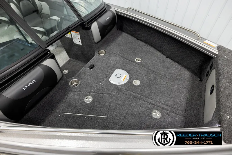 Slide: The Image of Interior of 2026 Lund 1975 Tyee boat with carpeted flooring and seating. - 8