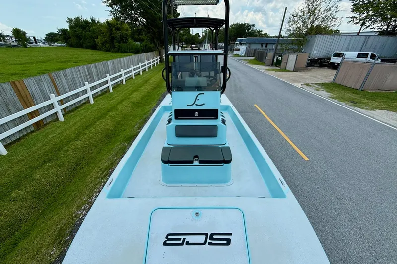 Slide: The Image of 2020 SCB R24 boat on road, featuring sleek design and light blue color. - 14