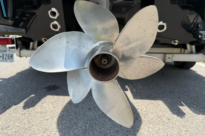 Slide: The Image of Close-up of a boat propeller on a 2020 SCB R24, showing five blades. - 18