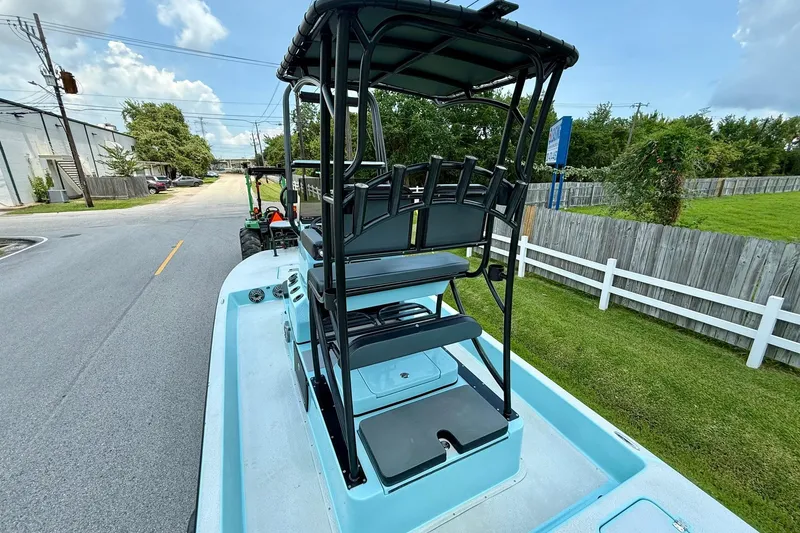 Slide: The Image of 2020 SCB R24 boat on road, featuring elevated seating and sleek design. - 8