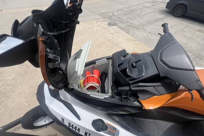 Slide: The Image of 2015 Sea-Doo Wake Pro 215 with open storage compartment, revealing safety equipment. - 11