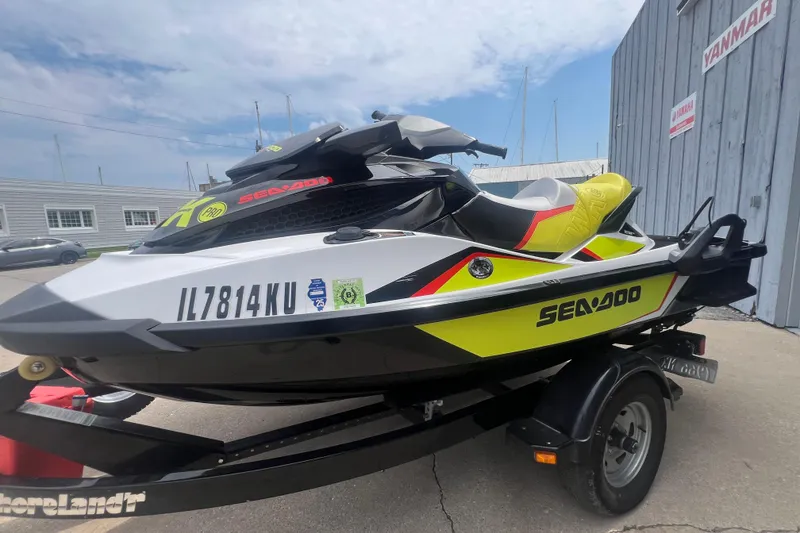 Slide: The Image of 2015 Sea-Doo Wake Pro 215 jet ski on trailer, parked outdoors. - 4