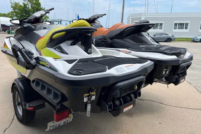 Slide: The Image of 2015 Sea-Doo Wake Pro 215 jet ski on trailer, parked outdoors. - 5