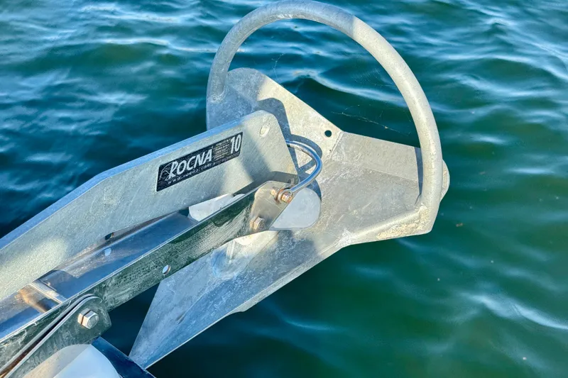 Slide: The Image of Rocna 10 anchor on Ranger 27 boat, 2012 model, over calm water. - 10
