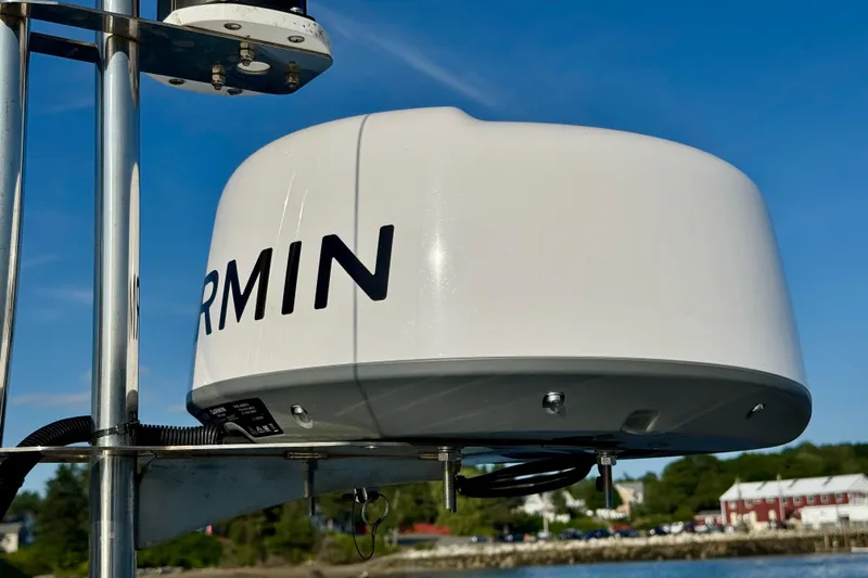 Slide: The Image of Garmin radar on Ranger 27 boat, 2012 model, against clear blue sky. - 19