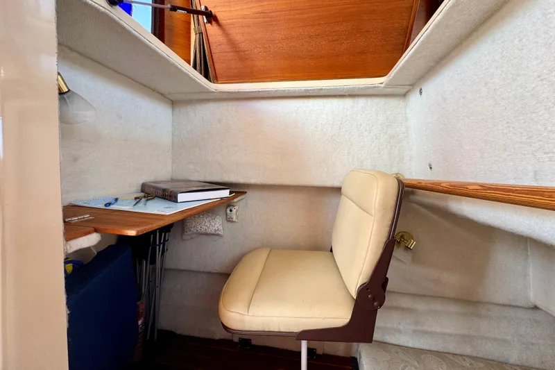 Slide: The Image of Cozy cabin workspace in 2012 Ranger 27 boat with desk and chair. - 53