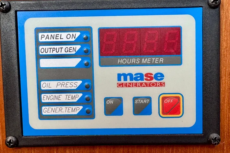 Slide: The Image of Control panel of a Mase generator with hour meter and status indicators. - 60